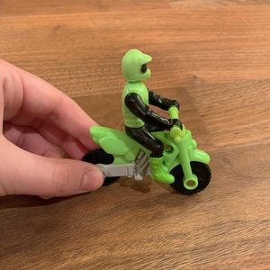 Green motorcycle with motorcyclist